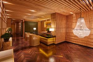 a lobby with wooden floors and a chandelier at The Centurion Classic Akasaka in Tokyo