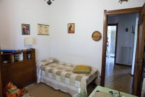 Posteľ alebo postele v izbe v ubytovaní EtnaFamilyHouse