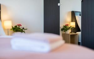 Łóżko lub łóżka w pokoju w obiekcie Modern Apartments Elle Malinska
