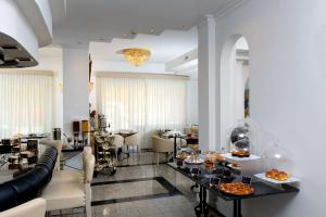 a living room with a table with food on it at Best Western Hotel Rivoli in Rome