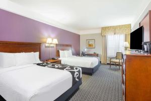 Ένα ή περισσότερα κρεβάτια σε δωμάτιο στο La Quinta by Wyndham Gainesville
