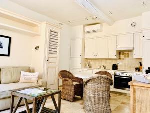 a living room with a couch and a table at Maison Saint-Tropez in Saint-Tropez