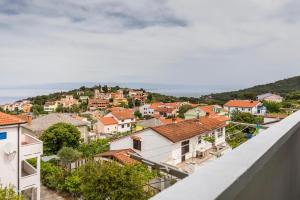 a view of a town from the roof of a building at Muzic Budget Double Room in Mali Lošinj