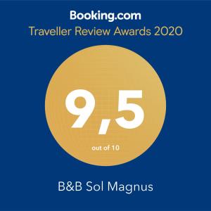 a symbol for a travel review awards with a yellow circle at B&B Sol Magnus in Stavelot