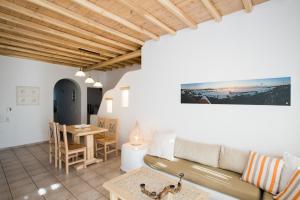 a living room with a couch and a table at Villa Meliti in Platis Gialos