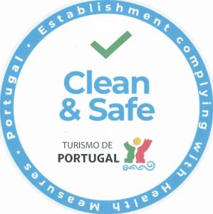 a label with the clean and safe logo at Portimão Center Hotel in Portimão