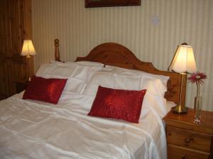 A bed or beds in a room at AbbeyCourt Kenmare Kerry