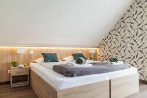 Posteľ alebo postele v izbe v ubytovaní Pilger Apartments