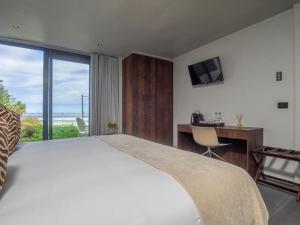 Cama o camas de una habitación en The Ocean View Guest House