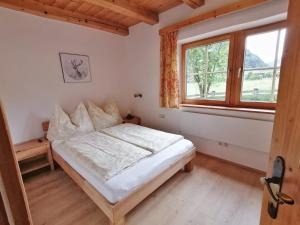 Posteľ alebo postele v izbe v ubytovaní Sonniges Landhaus in den Hohen Tauern