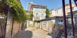 an alley in a city with a building at Berta Maria in Odesa +3 photos