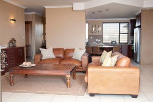 a living room with a couch and a coffee table at Cathkin Haven in Champagne Valley