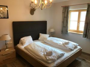 Postel nebo postele na pokoji v ubytování Platzhirsch