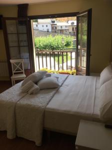 Postel nebo postele na pokoji v ubytování The Way Hotel Molinaseca