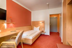 Postel nebo postele na pokoji v ubytování Hotel Jägerhaus