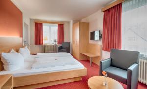 Postel nebo postele na pokoji v ubytování Hotel Jägerhaus