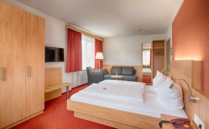Postel nebo postele na pokoji v ubytování Hotel Jägerhaus + 15 fotografií