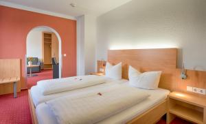 Postel nebo postele na pokoji v ubytování Hotel Jägerhaus