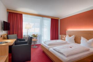 Postel nebo postele na pokoji v ubytování Hotel Jägerhaus