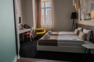Postel nebo postele na pokoji v ubytování Garni Hotel Eter