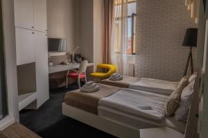 Postel nebo postele na pokoji v ubytování Garni Hotel Eter