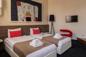 Postel nebo postele na pokoji v ubytování Garni Hotel Eter