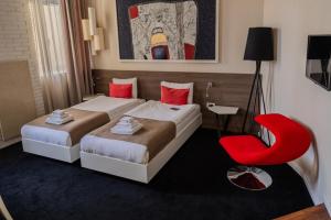 Postel nebo postele na pokoji v ubytování Garni Hotel Eter