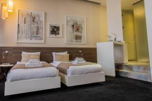 Postel nebo postele na pokoji v ubytování Garni Hotel Eter