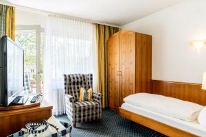 Postel nebo postele na pokoji v ubytování Kurhotel Markushof