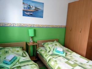 Postel nebo postele na pokoji v ubytování Apartment Harmonija apatin