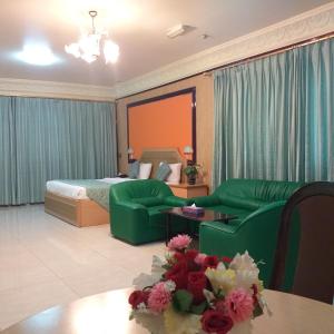 Ένα ή περισσότερα κρεβάτια σε δωμάτιο στο Bowshar International Hotel