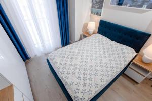 Posteľ alebo postele v izbe v ubytovaní Resort Apartamenty Klifowa Rewal 32