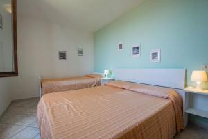 A bed or beds in a room at Appartamento Sergio