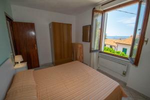 A bed or beds in a room at Appartamento Sergio