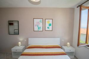 A bed or beds in a room at Appartamento Sergio