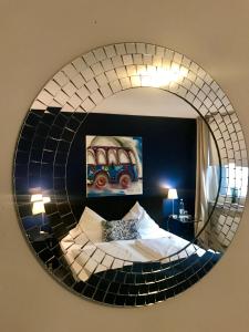 Postel nebo postele na pokoji v ubytování bensons hotel