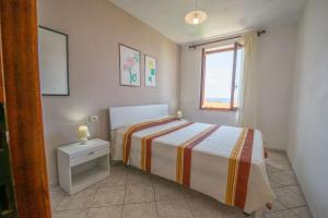 A bed or beds in a room at Appartamento Sergio