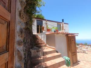 a set of stairs leading to a house at FREEDOM in Tablado de la Montañeta