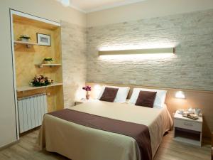 A bed or beds in a room at Albergo Ristorante il Fungo
