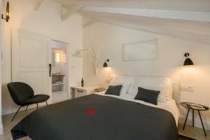 Säng eller sängar i ett rum på Palazzo De Bona