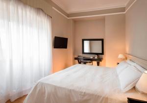 Postel nebo postele na pokoji v ubytování Ambasciatori Place Hotel