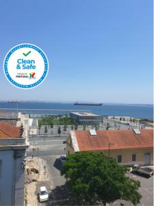 a view of a city with the ocean in the background at Alfama Apartments Services in Lisbon