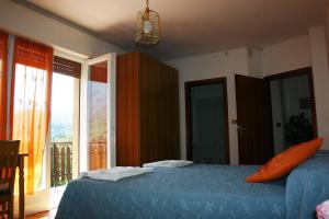 Postel nebo postele na pokoji v ubytování Hotel Passo Buole