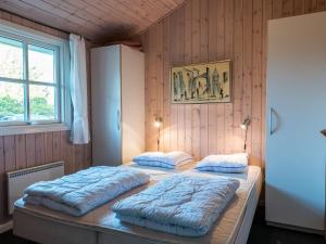 Postel nebo postele na pokoji v ubytování Holiday home Fanø LVI