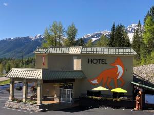 a hotel with a horse on the side of it at Fernie Fox Hotel in Fernie