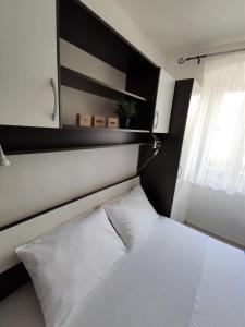 Łóżko lub łóżka w pokoju w obiekcie Apartman Josip