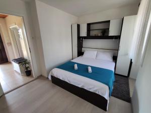 Łóżko lub łóżka w pokoju w obiekcie Apartman Josip