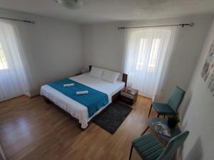 Łóżko lub łóżka w pokoju w obiekcie Apartman Josip