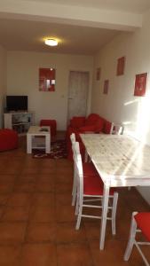 a living room with a table and a couch at Luštica Apartments in Luštica