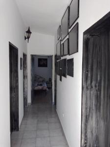 a hallway with pictures on the walls of a room at Luštica Apartments in Luštica